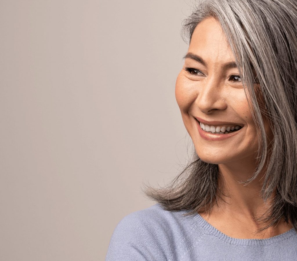 grey haired woman smiling